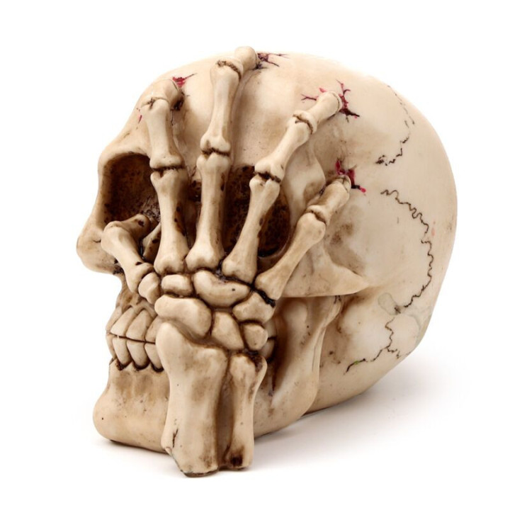 Figurine Crâne et main