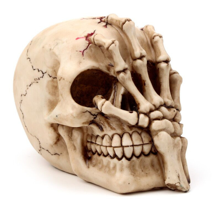 Figurine Crâne et main