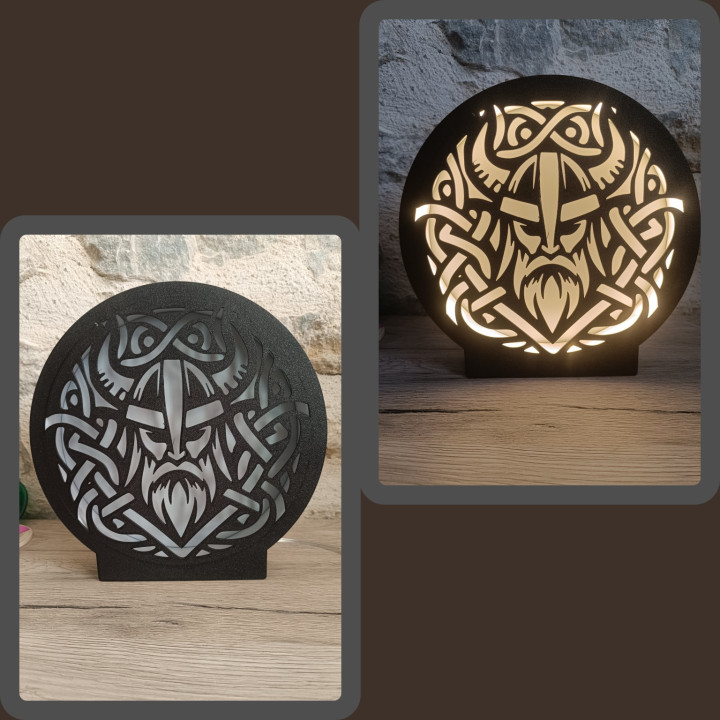 Lampe veilleuse ronde noire ajourée motif guerrier viking et entrelacs montrée éteinte et allumée