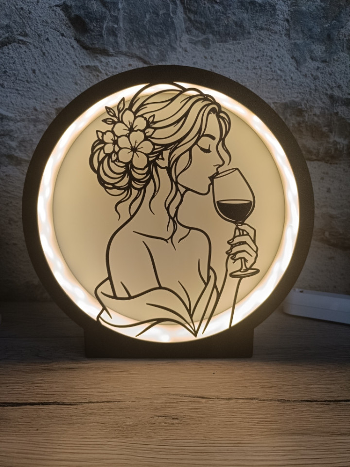 Lampe ronde lumineuse noire avec silhouette d'une femme buvant un verre de vin