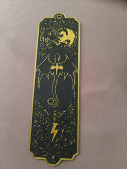 Marque-page noir et doré imprimé en 3D avec motifs de dragons et symbole d'éclair