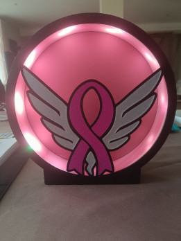 Veilleuse circulaire lumineuse avec ruban rose et ailes argentées