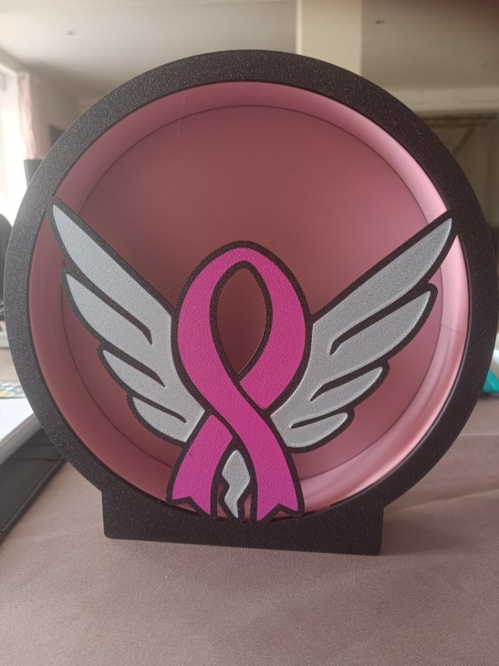 Veilleuse circulaire lumineuse avec ruban rose et ailes argentées