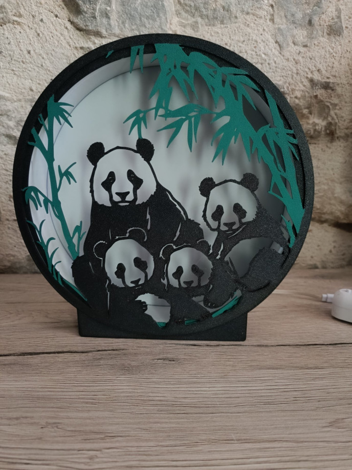 Veilleuse ronde noire silhouette famille pandas et bambous rétroéclairée