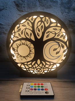Lampe veilleuse circulaire noire motif arbre de vie soleil lune allumée avec sa télécommande